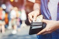 Close up the tourist holding an wallet in the hands of an man take money Royalty Free Stock Photo
