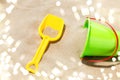 Close up of toy bucket and shovel on beach sand Royalty Free Stock Photo