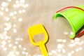 Close up of toy bucket and shovel on beach sand Royalty Free Stock Photo