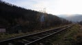 Close-up of tracks. Two railway tracks merge closely. Vintage tone. Rails and wooden sleepers Royalty Free Stock Photo