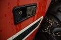 A close-up of a tractor door and tire with a chain Royalty Free Stock Photo