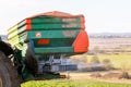 Close up of Tractor and fertilizer spreader in field