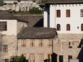 Close Up of a Traditional Albanian Whitewashed and Stone Apartment Buildings Built on a Hill