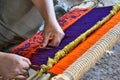 Close-up of traditional Aymara weaving in the making on an old fashioned wooden loom