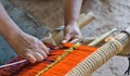 Close-up of traditional Aymara weaving in the making on an old fashioned wooden loom