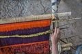 Close-up of traditional Aymara weaving in the making on an old fashioned wooden loom