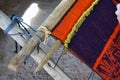 Close-up of traditional Aymara weaving in the making on an old fashioned wooden loom
