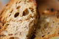 Close-up on traditional bread with cereals and seeds. The texture of the bread with blurred background. Royalty Free Stock Photo