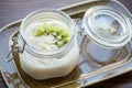 Close-up of a traditional breakfast - oatmeal with homemade milk and sweet kiwi. Concept - breakfast in a cafe Royalty Free Stock Photo