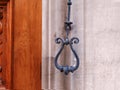 Close-up of traditional cast iron doorbell handle