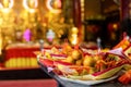 Close up of Traditional Chinese talisman and orange fruit for pay homage to god`s lucky in chinese temple, Selective focus