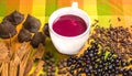 Close up of traditional Ecuadorian dish, colada morada and differente species over a colorful fabric