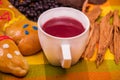 Close up of traditional Ecuadorian dish, colada morada and differente species over a colorful fabric