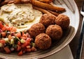 Close-up of Traditional falafel balls with salad and hummus on a