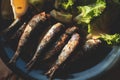 Close-up of traditional greek dish - grilled sardines, roasted sardinas on a plate with potatoes and vegetables, in Corfu island Royalty Free Stock Photo