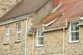 Close-up on traditional houses with brickstone and flagstone roofs in Swanage