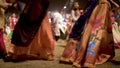 Close up of traditional indian dresses of indian women moving in slow motion while dancing Garba during the Hindu Navratri