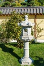 Close-up of traditional Japanese stone lamp, Snow Lantern by Yukimi Toro in Japanese garden Royalty Free Stock Photo