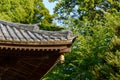 Traditional Japanese temple or shrine roof with ancient bell, Japan Royalty Free Stock Photo