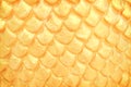 Close up traditional naga scale stucco patterns texture in Thai temple , Gold abstract background Royalty Free Stock Photo