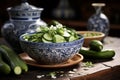 Close-up of traditional russian dumplings, shot of vodka, and pickled cucumbers on the table