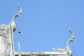 Traditional Silver sculpture on roof with clear sky background