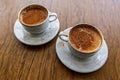 Traditional turkish hot drink sahlep or salep in white cup on brown background.