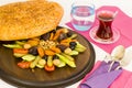 Traditional Turkish Ramadan Iftar Wooden Plate with Ramadan Bread,a glass of water and tea