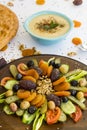 Traditional Turkish Ramadan Iftar Wooden Plate with Lentil Soup and Ramadan Bread