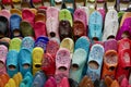 Close up of traditional vibrant slippers, babouches, in the souk. Marrakech, Morocco. Royalty Free Stock Photo