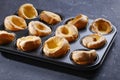 Close-up of Yorkshire puddings in a baking tray