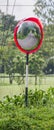 Close up traffic convex mirror on side road.