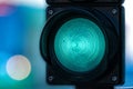 Close-up of traffic semaphore with green light on defocused city street background with copy space Royalty Free Stock Photo