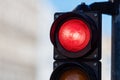 Close-up of traffic semaphore with red light on defocused city street background with copy space Royalty Free Stock Photo