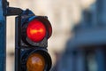 Close-up of traffic semaphore with red light on defocused city street background with copy space Royalty Free Stock Photo