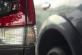 Close-up trail light of car in parking lot with blurred of other car. Royalty Free Stock Photo