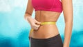 Close up trained belly with measuring tape Royalty Free Stock Photo