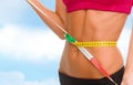 Close up of trained belly with measuring tape Royalty Free Stock Photo