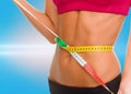 Close up of trained belly with measuring tape Royalty Free Stock Photo