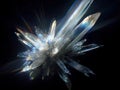 Close-up of a translucent crystalline cluster, emitting an icy iridescent glow with refracted halos The background is dark Royalty Free Stock Photo