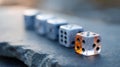 Close-up of translucent dice arranged in a row on a textured surface with shallow depth of field and soft natural lighting Royalty Free Stock Photo
