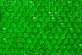 Close up of translucent green crystals. Green beads glittering and shining in the light Royalty Free Stock Photo