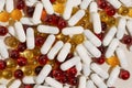 Close-up of transparent yellow, red and white capsule pills mixed. The concept of pharmacy, health, medicine, dietary supplements Royalty Free Stock Photo