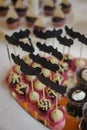 Close up of tray with lot delicious diversity pastry cakes tartlets and macaroon in a row. Fresh, multicoloured, colourful, green