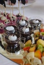 Close up of tray with lot delicious diversity pastry cakes tartlets and macaroon in a row. Fresh, multicoloured, colourful, green