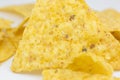 Close up, Triangular chips, mexican nachos, on white background. Perfect Tasty spicy snack for a beer Royalty Free Stock Photo