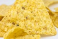 Close up, Triangular chips, mexican nachos, on white background. Perfect Tasty spicy snack for a beer Royalty Free Stock Photo