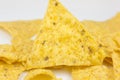 Close up, Triangular chips, mexican nachos, on white background. Perfect Tasty spicy snack for a beer Royalty Free Stock Photo