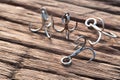 Close up Triple fishing Hook on wood plate