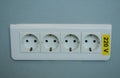 Close up of a triple wall jack, 220 v, electric symbol Royalty Free Stock Photo